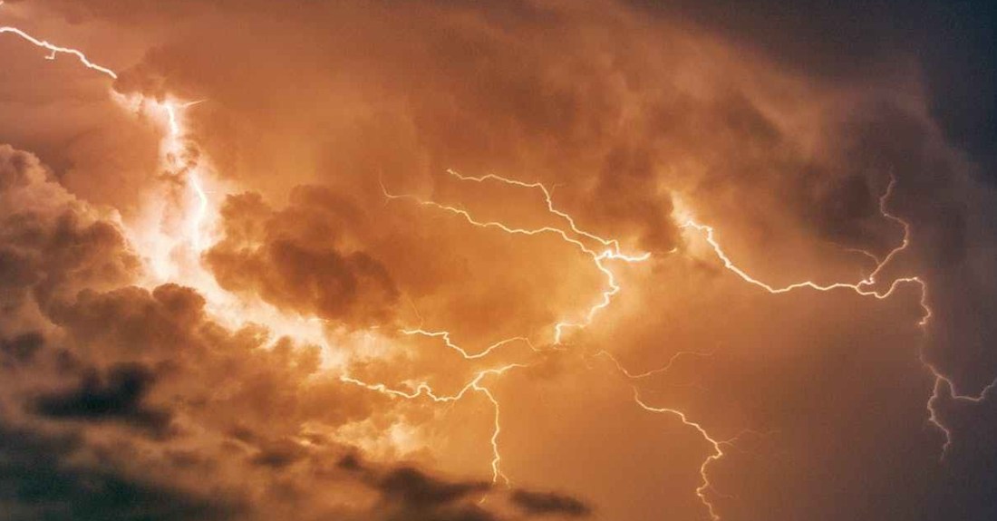 blue body of water with orange thunder